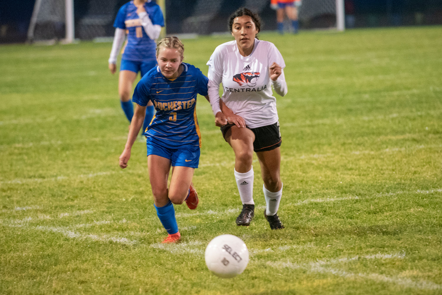 Rochester's Piper Quarnstrom (5) and Centralia's Isabelle Gruginski (2) race for a loose ball.