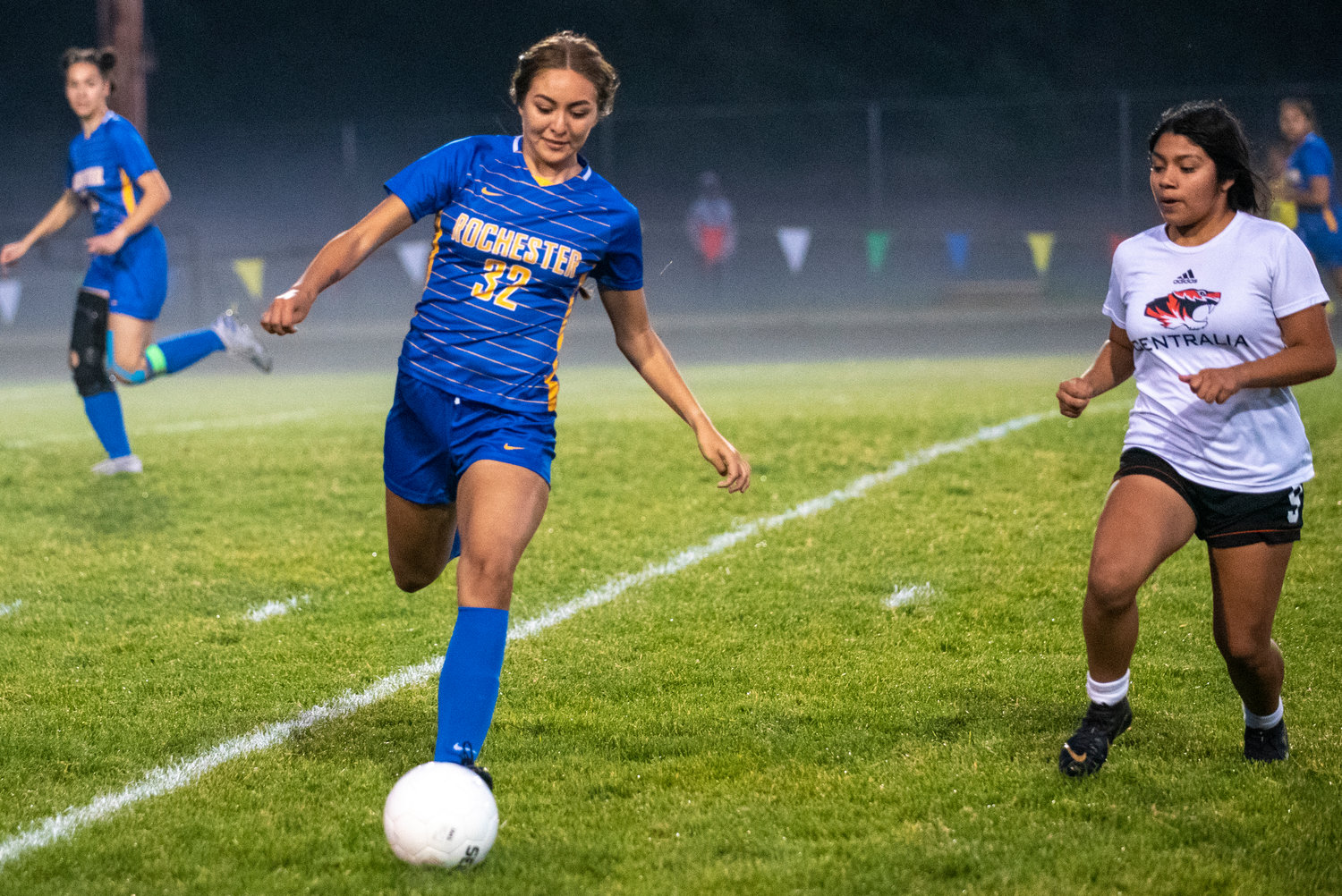 Rochester's Nadia Martinez (32) collects a pass from a teammate with Centralia's Alia Gomez-Ortiz (9) defending on Thursday.