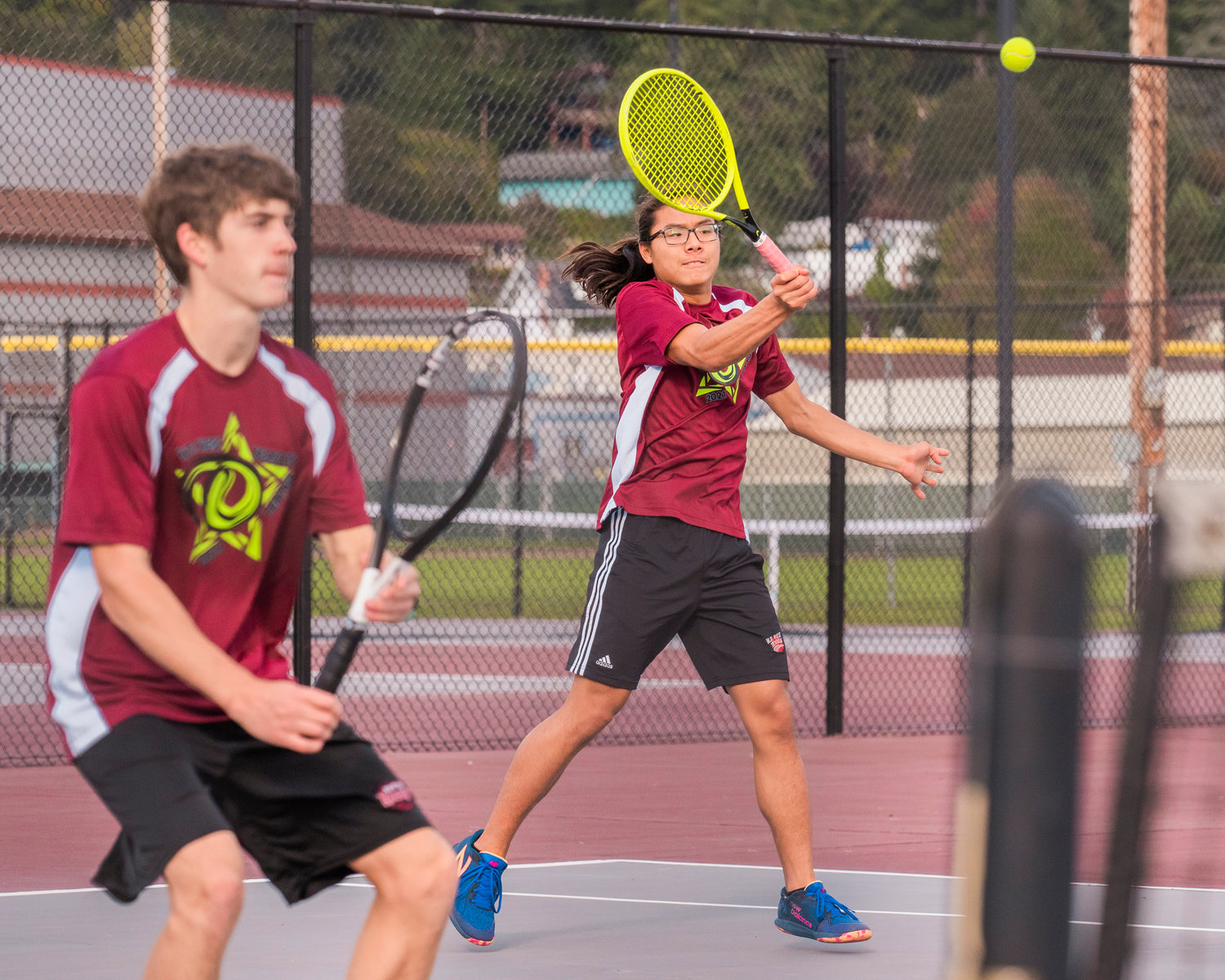 FILE PHOTO -- W.F. West’s Joseph Chung returns a ball during a doubles match with Aaron Boggess in Chehalis earlier this season.