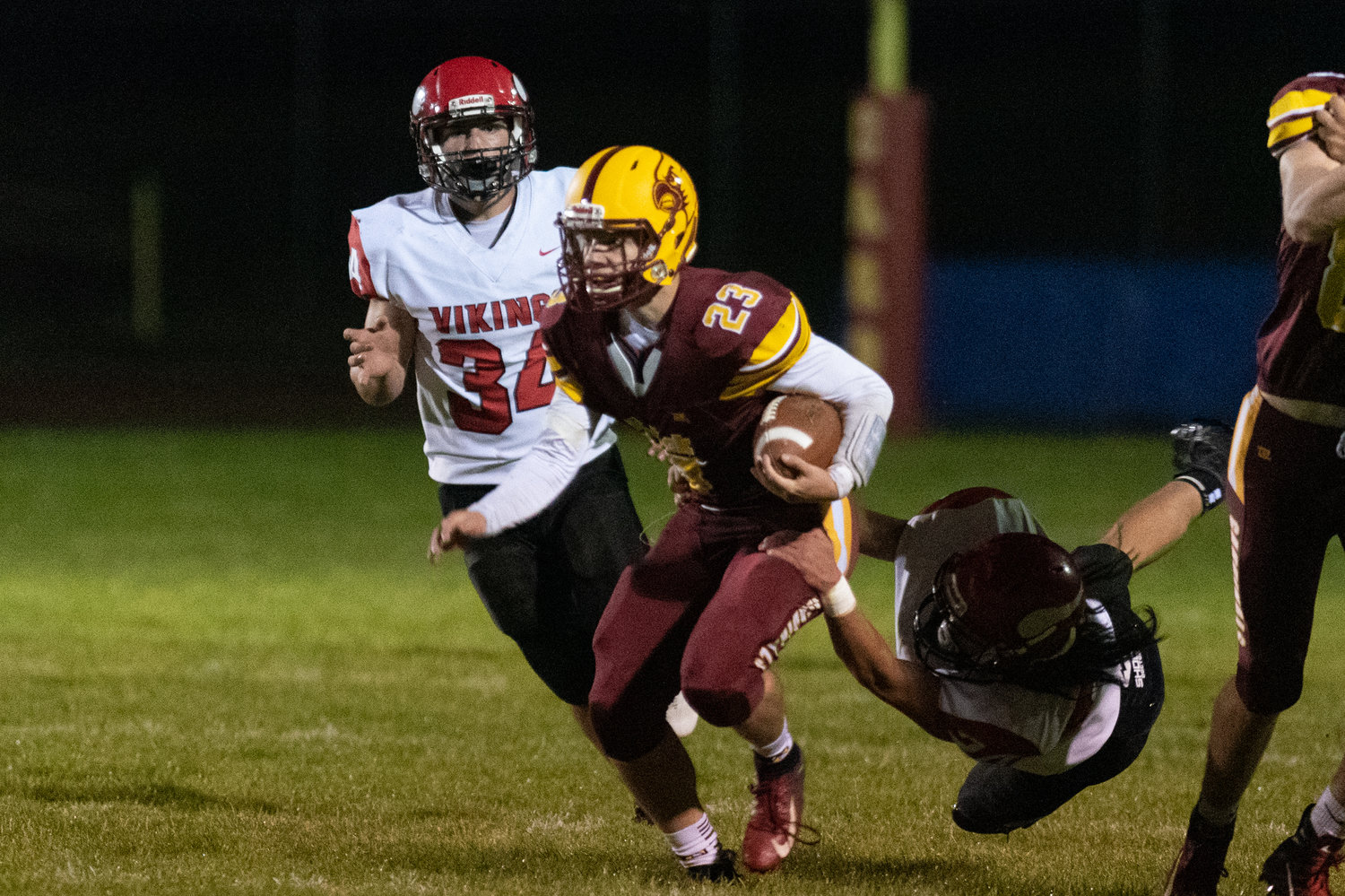 FILE PHOTO -- Winlock quarterback Neal Patching breaks a tackle in the Cardinals win over Mossyrock Oct. 8.