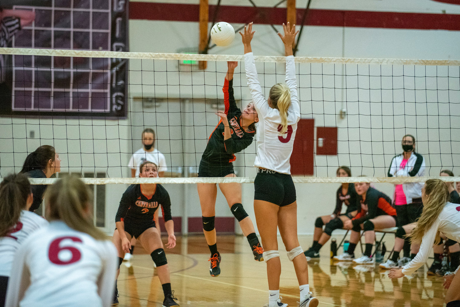 FILE PHOTO -- Centralia's Ella Orr (3) spikes the ball past W.F. West's Ava Olsen (9) during the first leg of the Swamp Cup Oct. 12 in Chehalis.