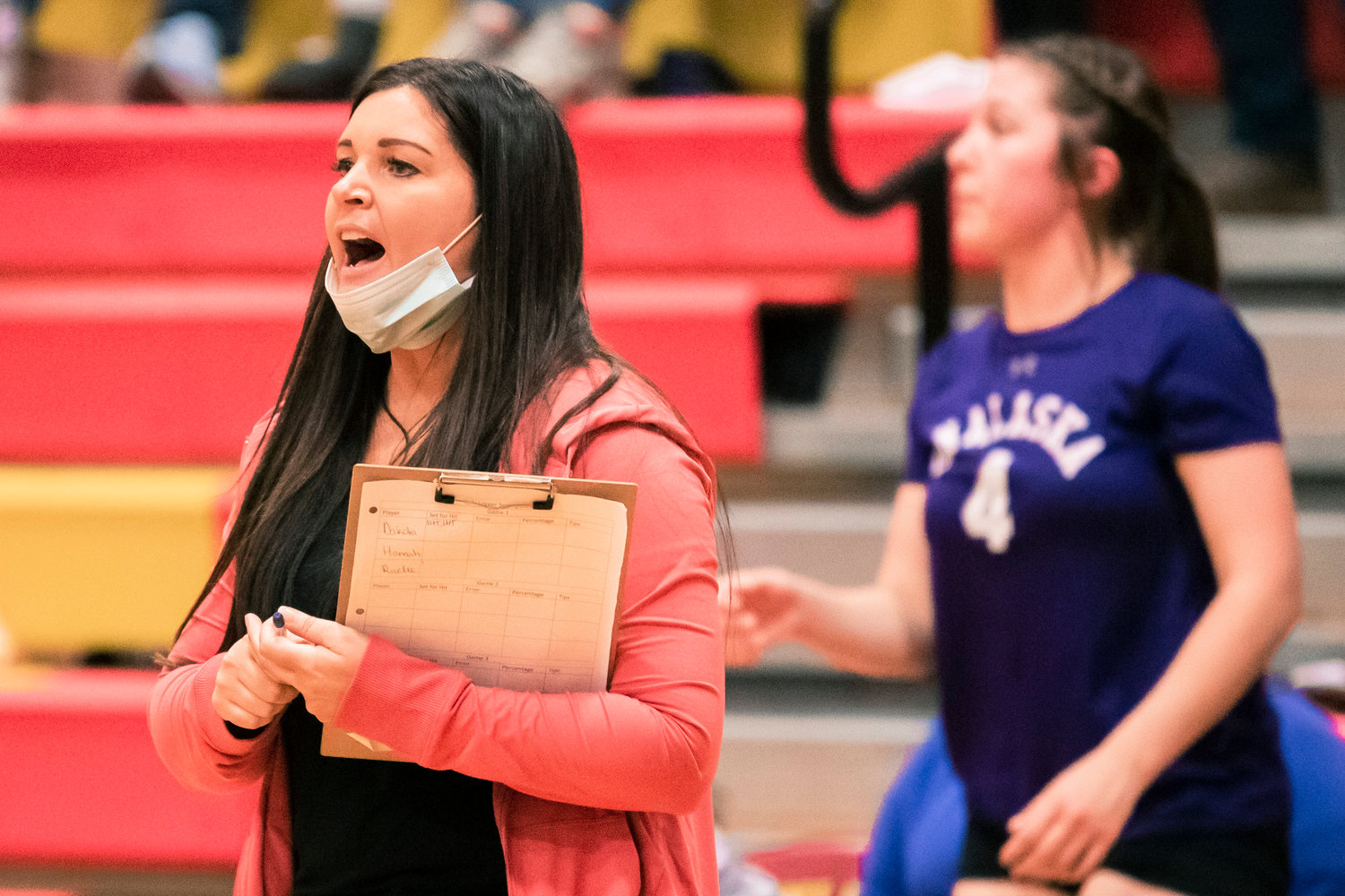 Onalaska’s Head Coach Jennifer Hamilton yells to players on the court during a volleyball game Thursday in Winlock.