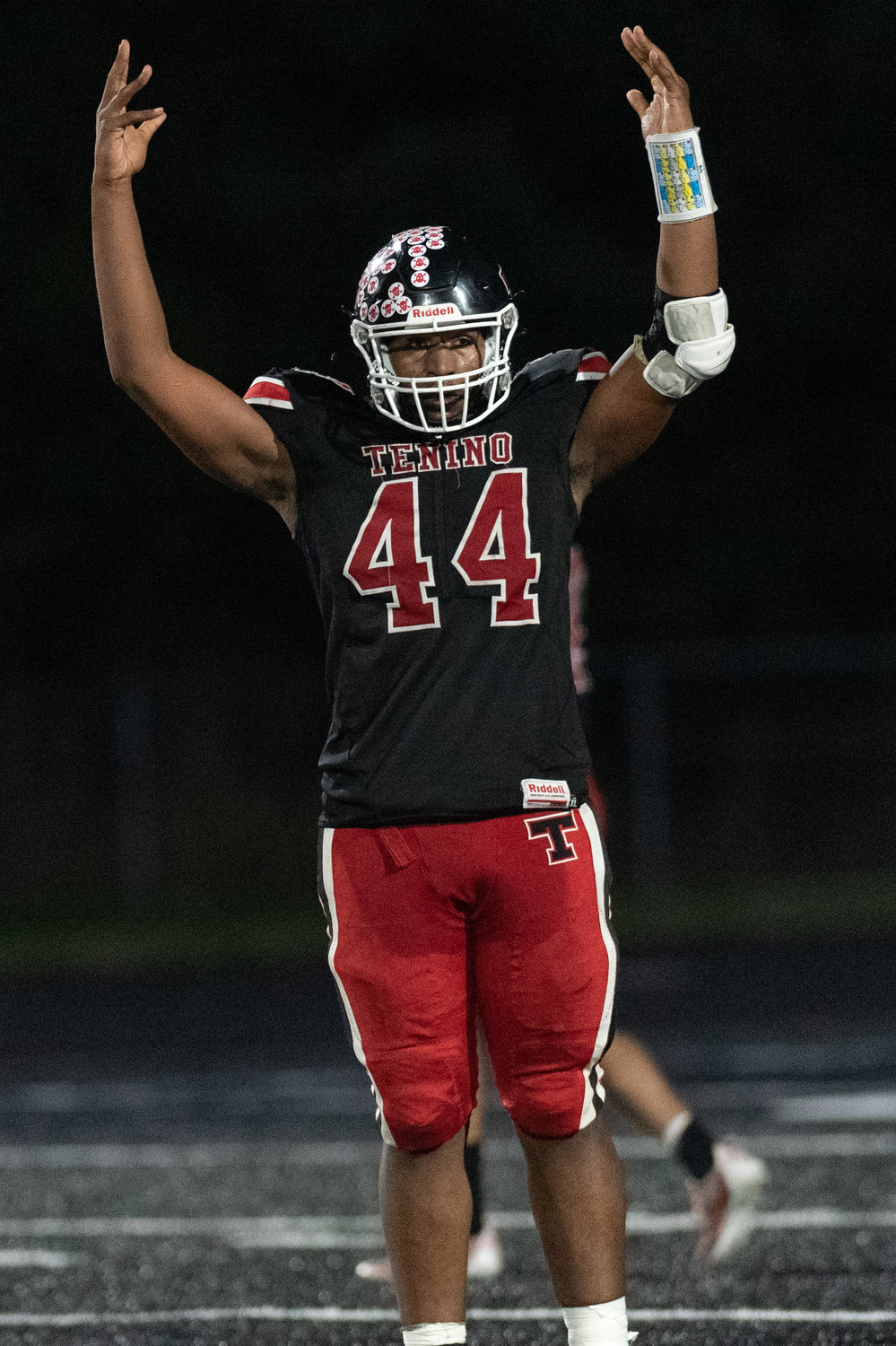 Tenino defensive end Takari Hickle pumps up the crowd against Montesano Oct. 15.