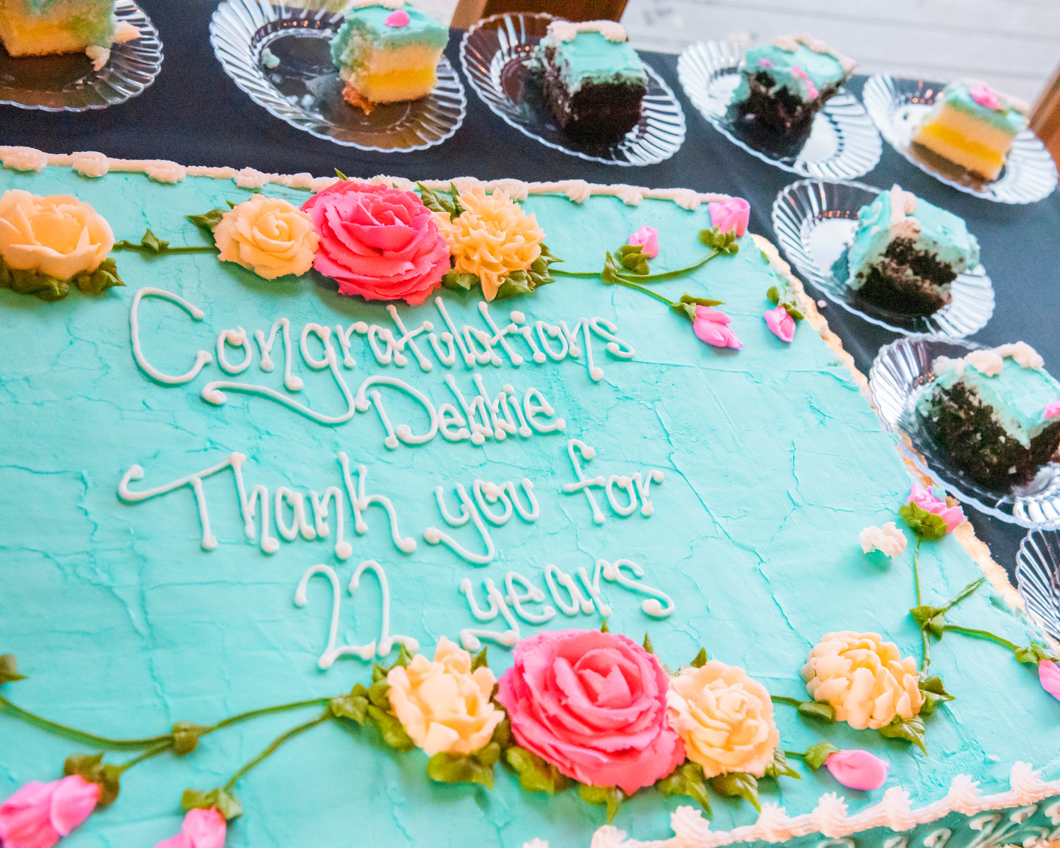 A cake reads “Congratulations Debbie, Thank you for 22 years” during a retirement party Friday in Chehalis.