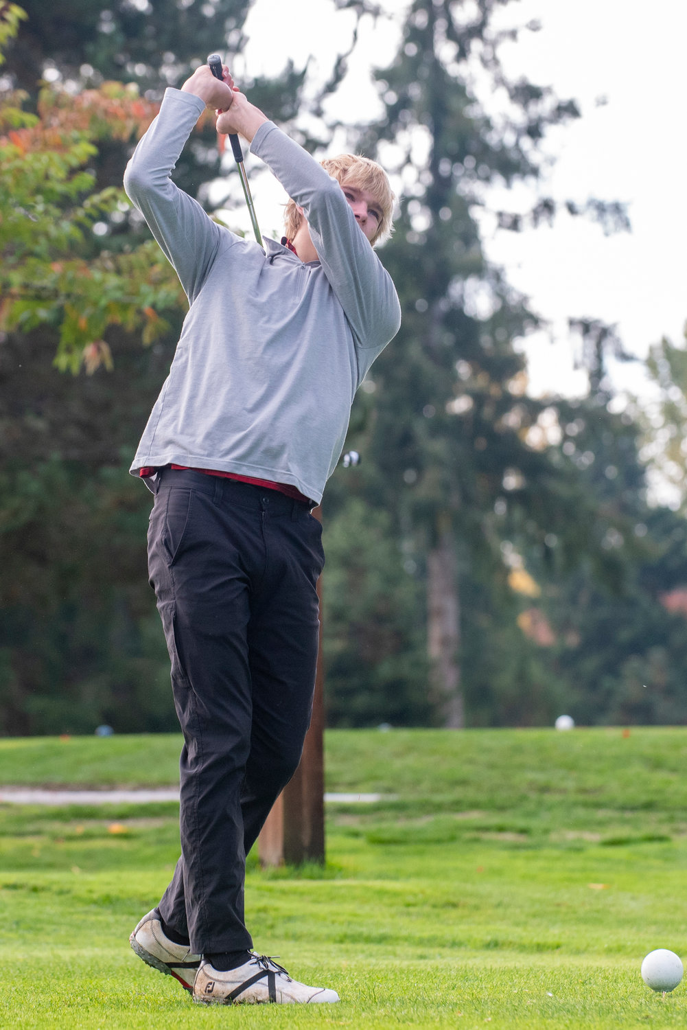 W.F. West senior Dirk Plakinger tees off on Day One of the 2A District 4 Boys Golf Tournament at Riverside Golf Course in Chehalis on Oct. 20, 2021.