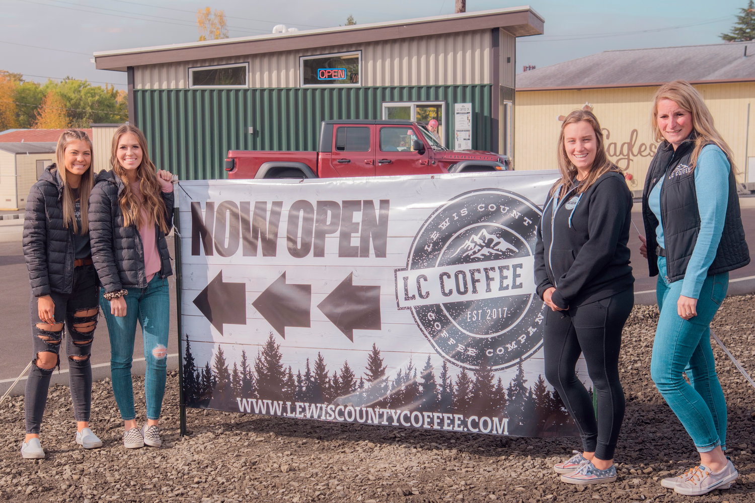 From left, Beth and Angie Twining, Keshia Stockdale and Sam Styger pose for a photo Tuesday outside the newly opened Lewis County Coffee Company stand along Jackson Highway in Chehalis.