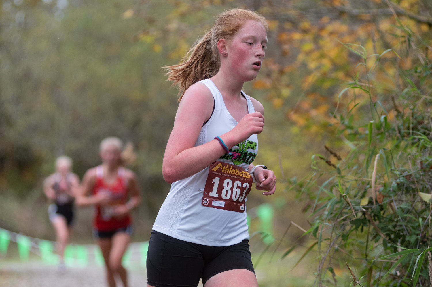 A Tumwater runner makes a turn at the 2A Evergreen Championships at Pioneer Park Oct. 20.
