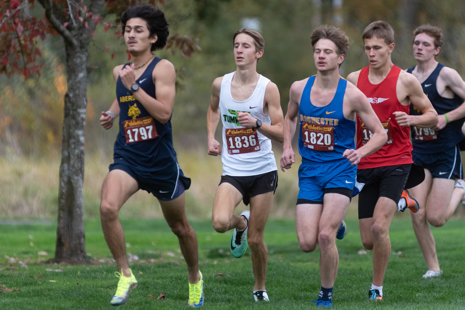 Tumwater's John Hoffer and Rochester's Levi Jennings try to keep pace with Aberdeen's Julian Campos out of the gate at the 2A Evergreen Championships at Pioneer Park Oct. 20.