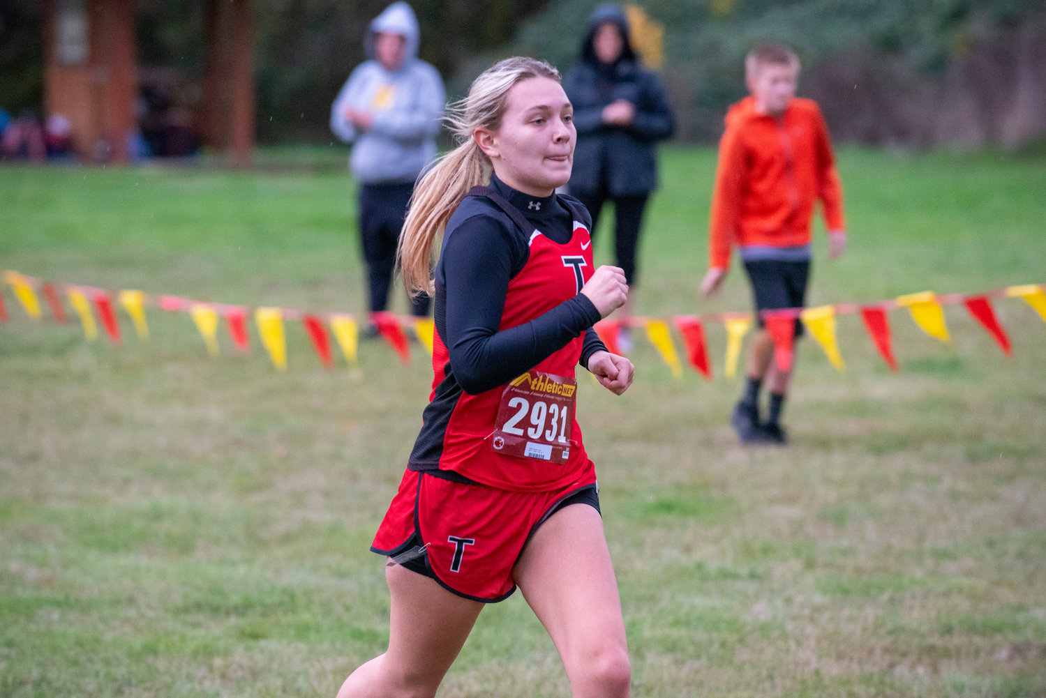 Toledo's Candace Clark approaches the finish line of the 2B Central League cross country championships on Oct. 21, 2021.