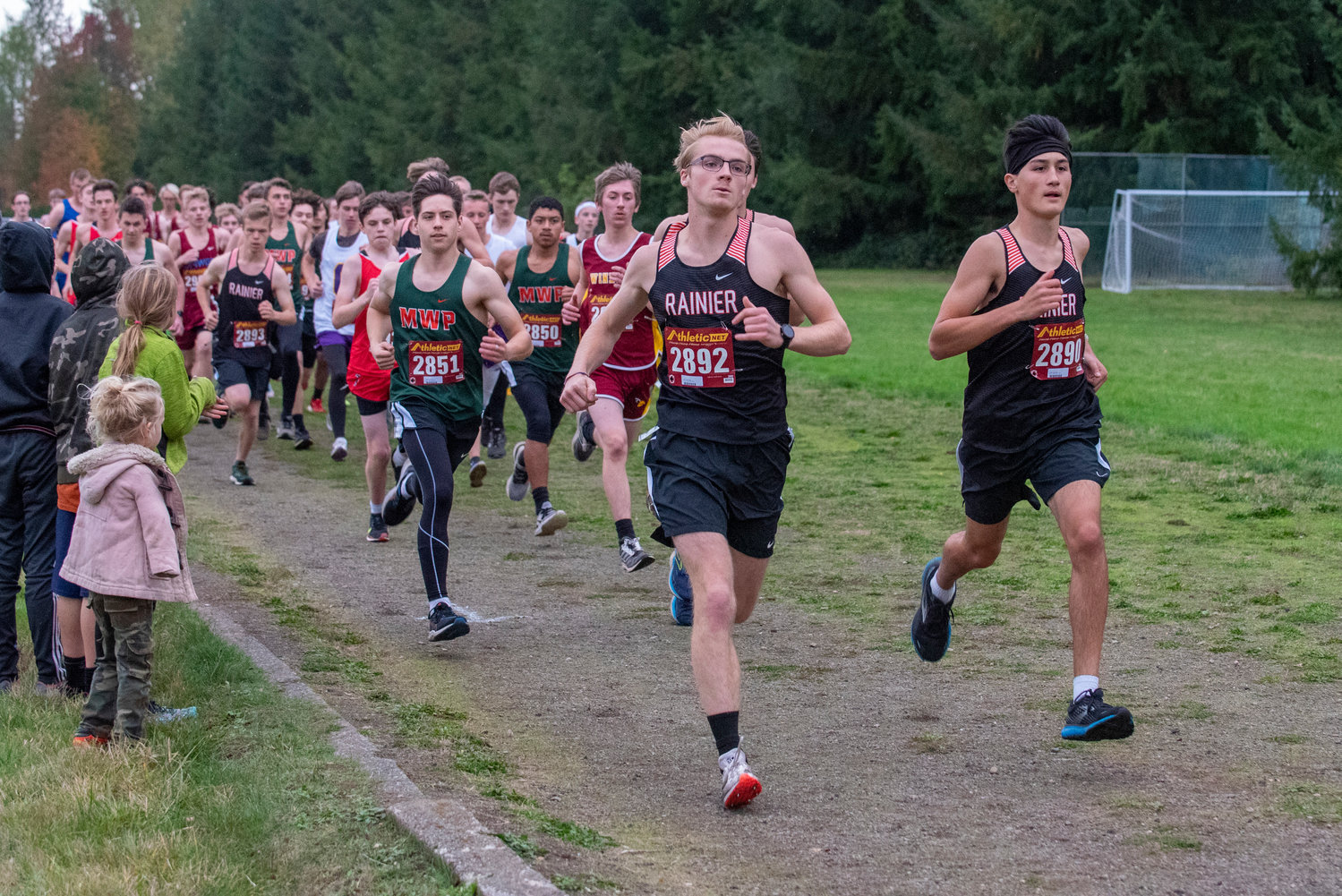 Rainier's Ryan Doidge (2892) and Dylan Davis (2890) lead the pack of runners out of the starting line of the 2B Central League cross country championships in Onalaska on Oct. 21, 2021.