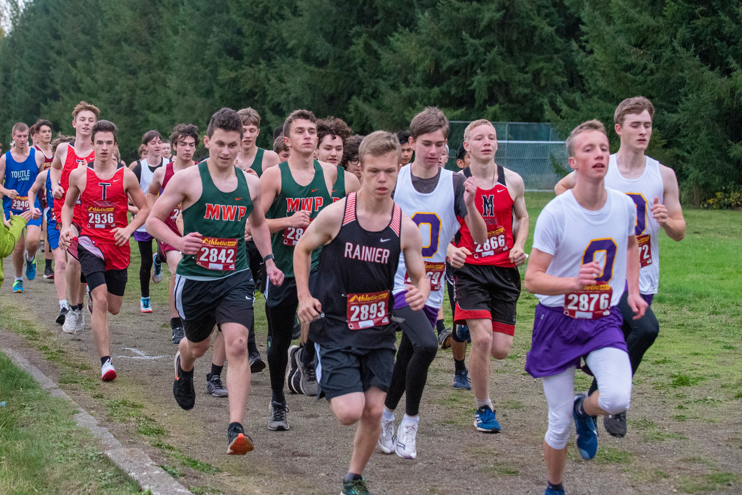 A pack of boys runners take off from the starting line of the 2B Central League cross country championships on Oct. 21, 2021.
