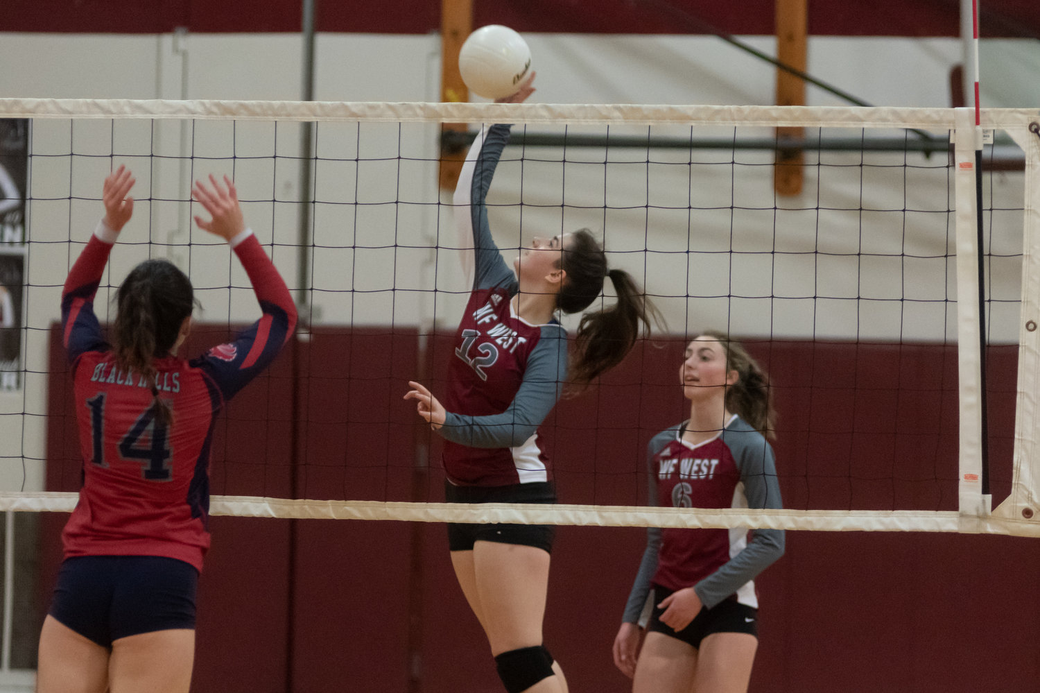 W.F. West senior Maggie Busse hits a spike across the net against Black Hills Oct. 21.