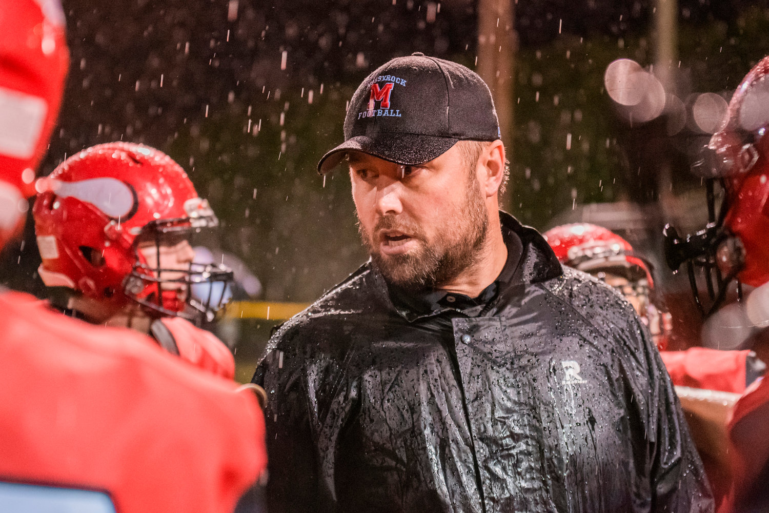 Mossyrock Head Coach Eric Ollikainen talks to players during a game Thursday night at home.