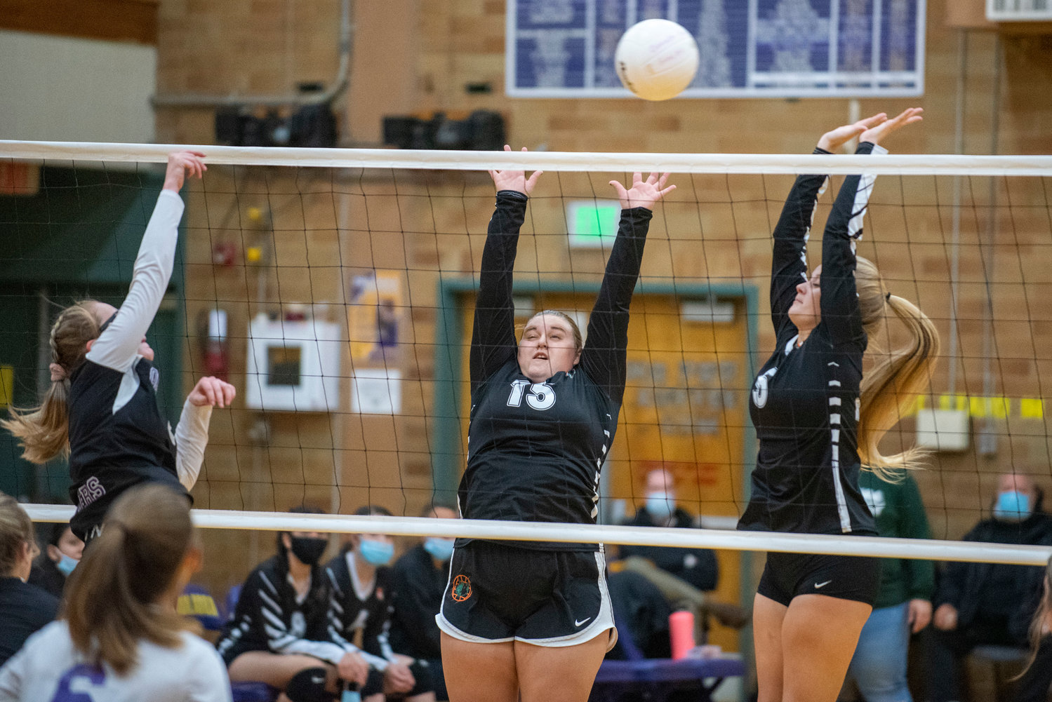 Morton-White Pass' Kelly Pakar (15) and Breejah Townsend (5) attempt to block a spike against Onalaska's Hannah James on Oct. 25, 2021.