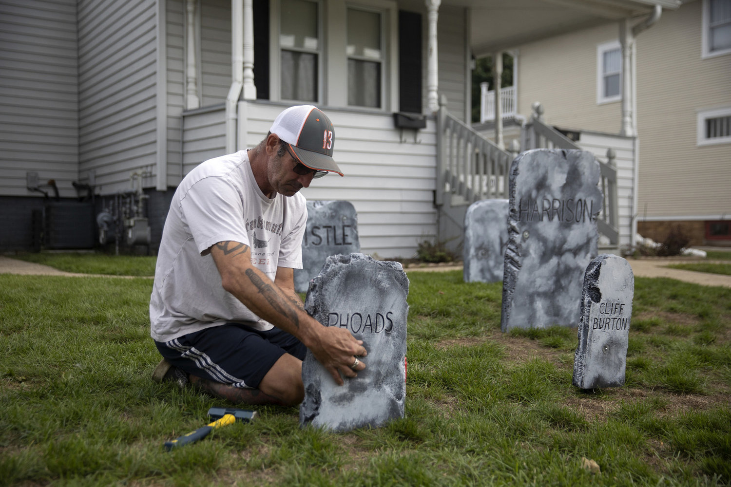 Chris Wade, 52, puts up Halloween decorations in his yard on Tuesday, Oct. 19, 2021, in Kenosha, Wisconsin, after sharing his thoughts on the mood in town as the trial of Kyle Rittenhouse approaches, set to begin Nov. 1.  (Erin Hooley/Chicago Tribune/TNS)