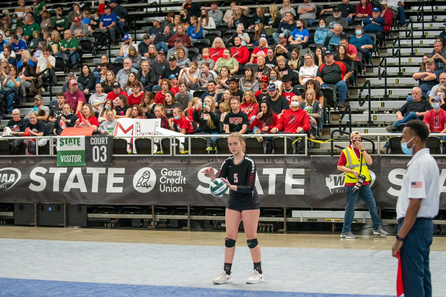Mossyrock’s Jolee Hadaller prepares to serve to Oakesdale during the 1B state championship match Friday in Yakima.