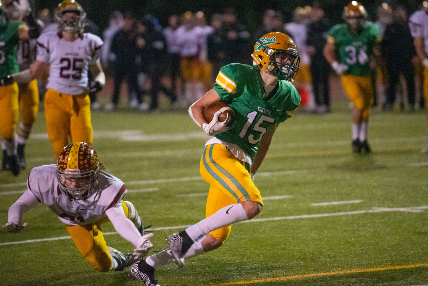 Tumwater’s Ashton Paine (15) crosses the goal line for a rushing touchdown against Enumclaw in the 2A state quarterfinals Nov. 19.