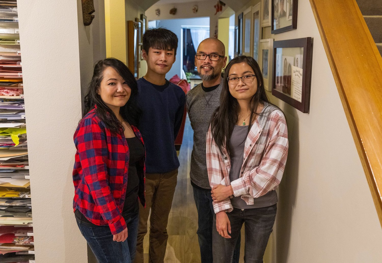 Son Duong (second from right) came to the U.S. as a child after the fall of Saigon. Now, he and his family (from left, wife Reina, son Nathan and daughter Cyan) want to help Afghan refugees resettle in the Seattle area through a new federal program.