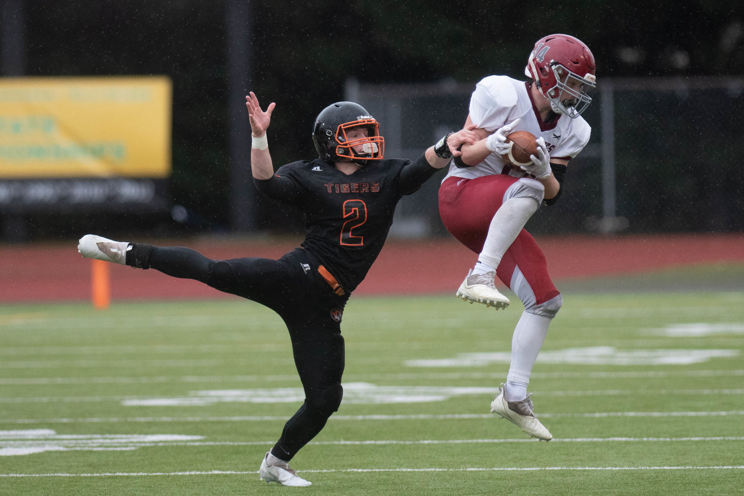 Napavine's Cael Stanley tries to take down an Okanogan receiver in the 2B state semifinals at Tumwater Nov. 27.
