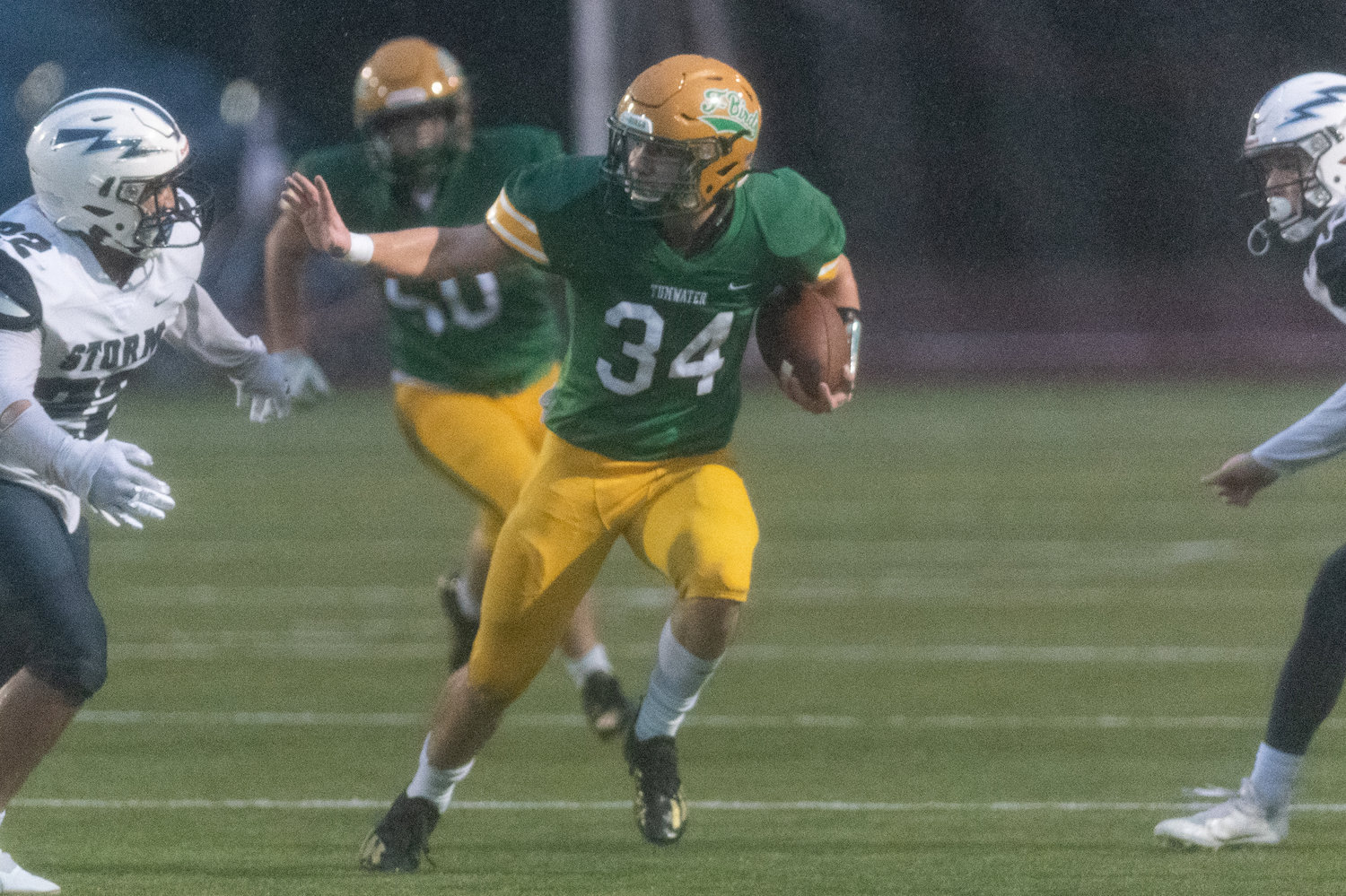 Tumwater tailback Payton Hoyt looks to stiff arm a defender in the 2A state semifinals against Squalicum Nov. 27.