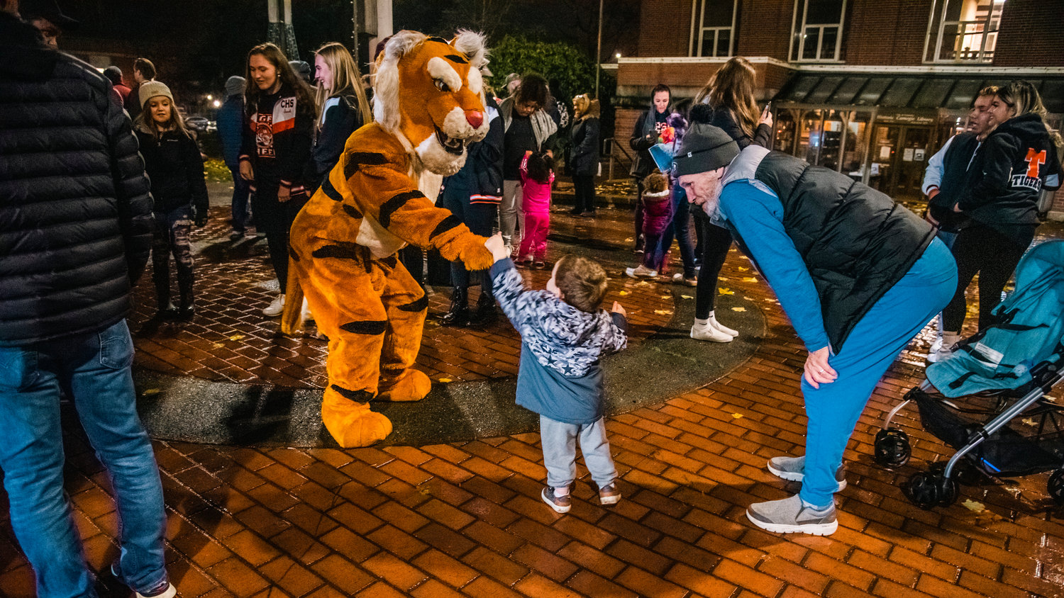 The Centralia High School mascot greets kids in George Washington Park during a Christmas tree lighting ceremony Friday night.