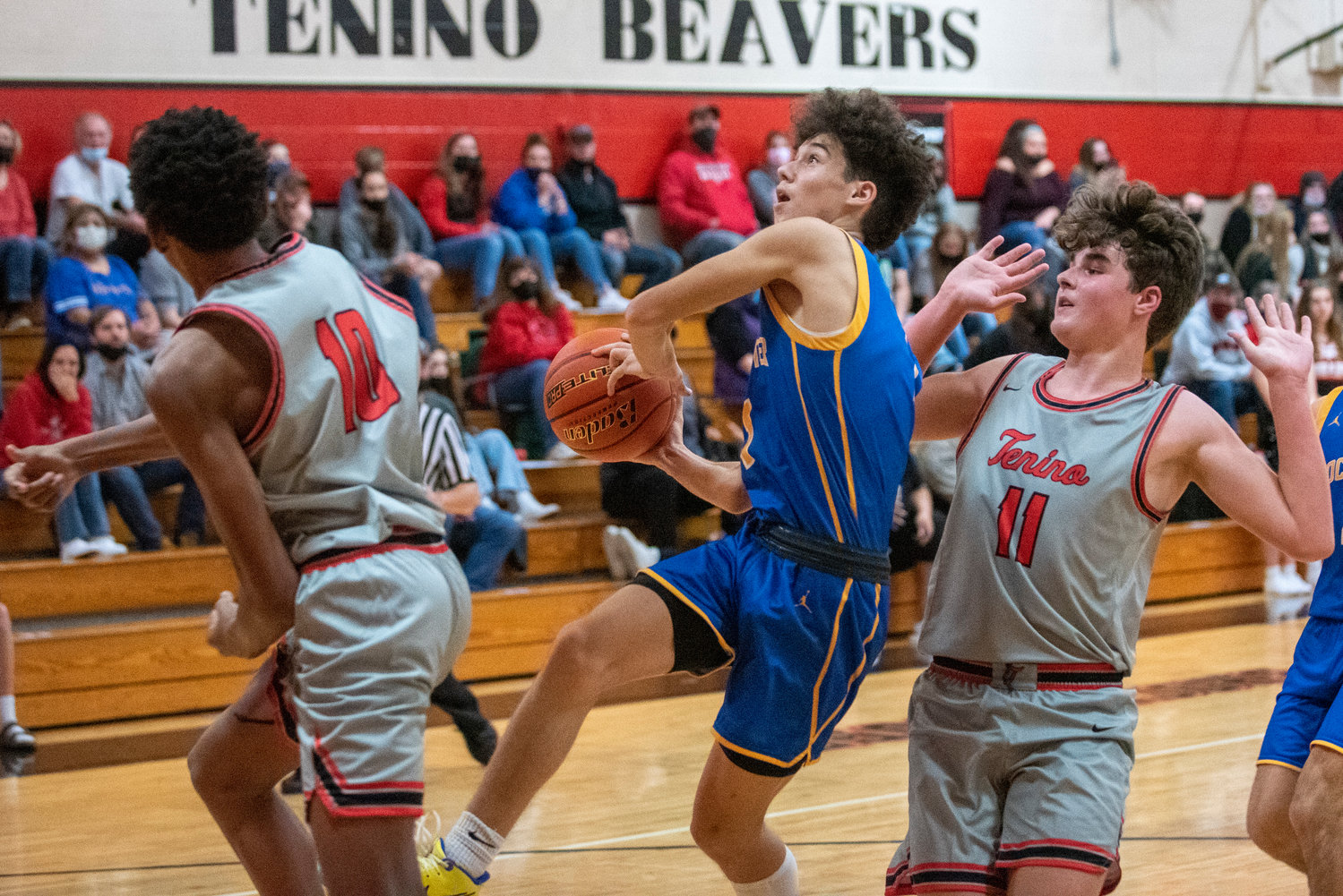 Rochester's Parker McAferty  drives to the bucket against Tenino on Nov. 29.