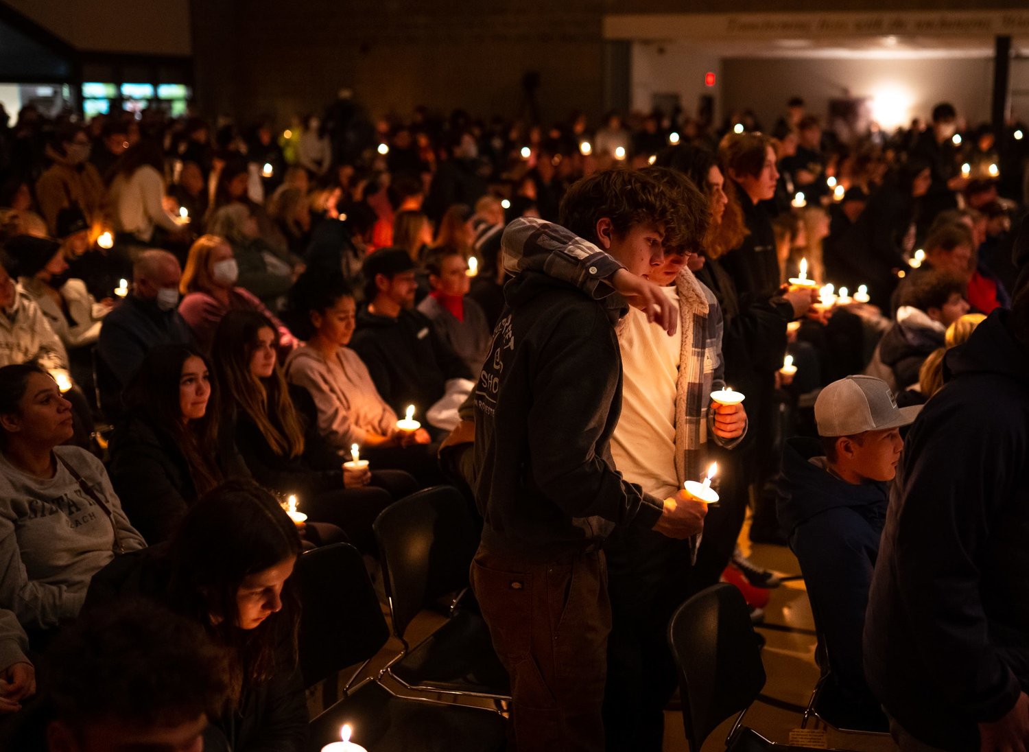 Oxford High School students who were present during the school shooting stand during a prayer vigil at LakePoint Community Church in Oxford, Michigan following an active shooter situation at Oxford High School on Tuesday, Nov. 30, 2021. Police took a suspected shooter into custody and there were multiple victims, the Oakland County Sheriff's office said. (Ryan Garza/Detroit Free Press/TNS)