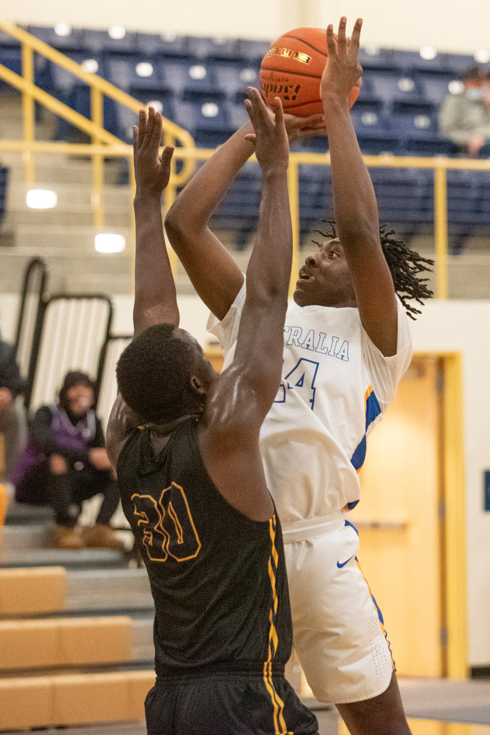 Centralia College's Abraham Konan (24) goes up for two points against a Portland defender on Dec. 1.