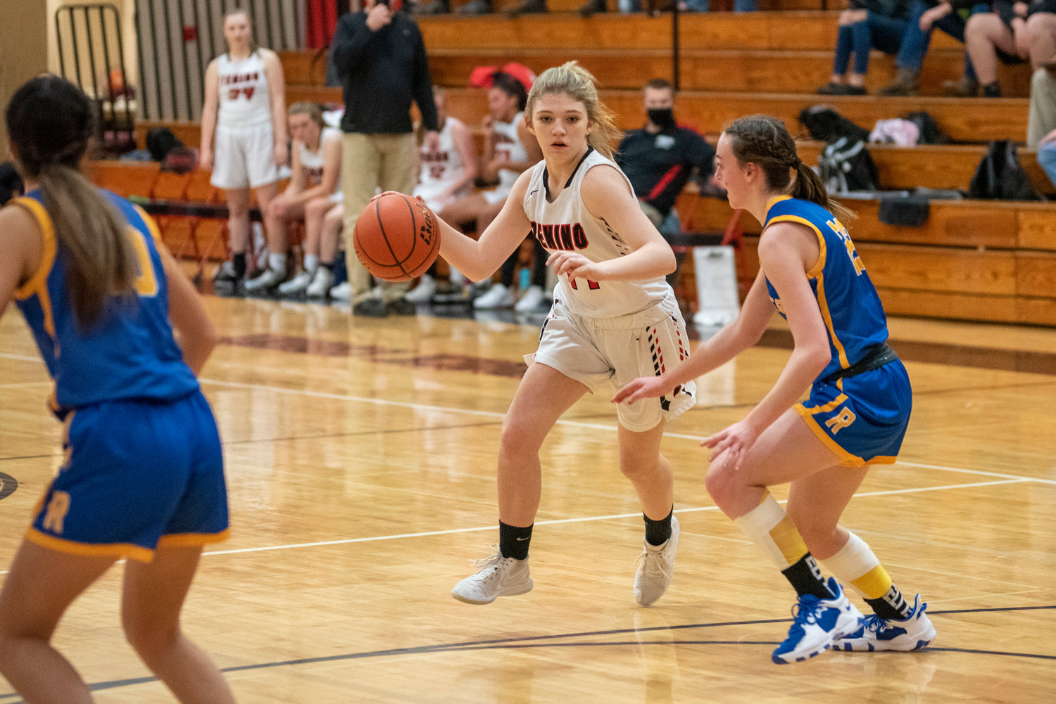Tenino's Brianna Asay (14) looks for open space against Rochester on Dec. 2.