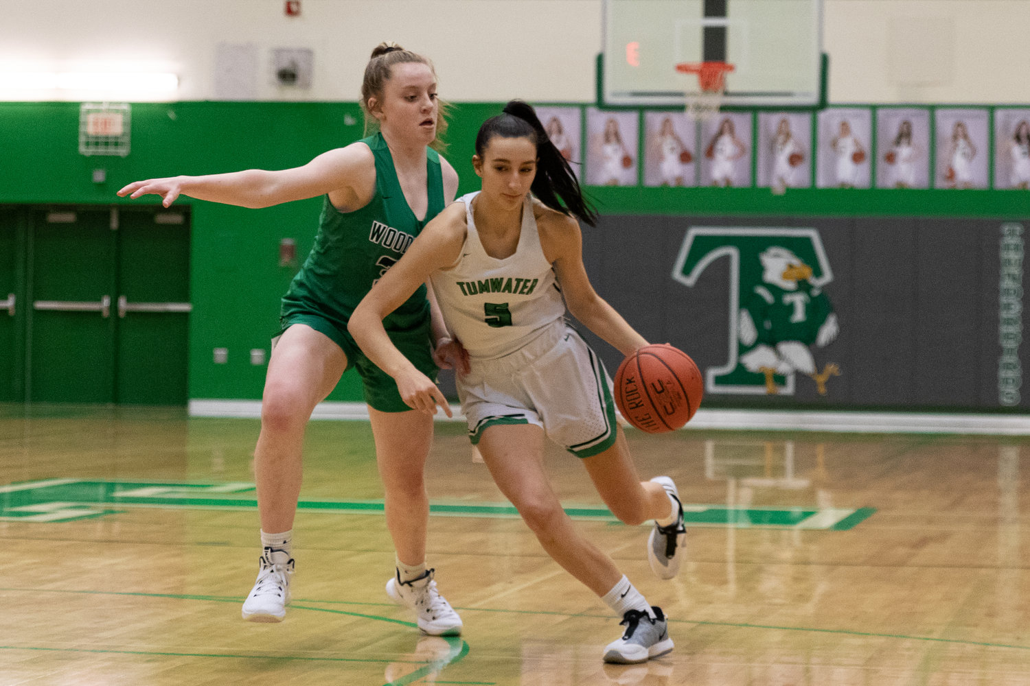 Tumwater forward Natalie Sumrok drives down the lane against Woodinville Dec. 2.