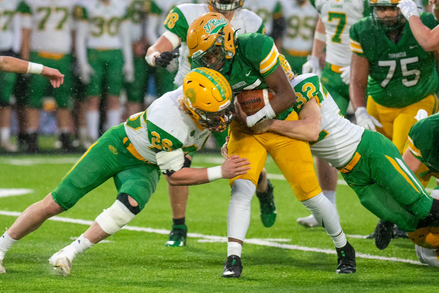 Tumwater running back Carlos Matheney goes head-to-head with a Lynden player during the 2A state title game on Dec. 4.