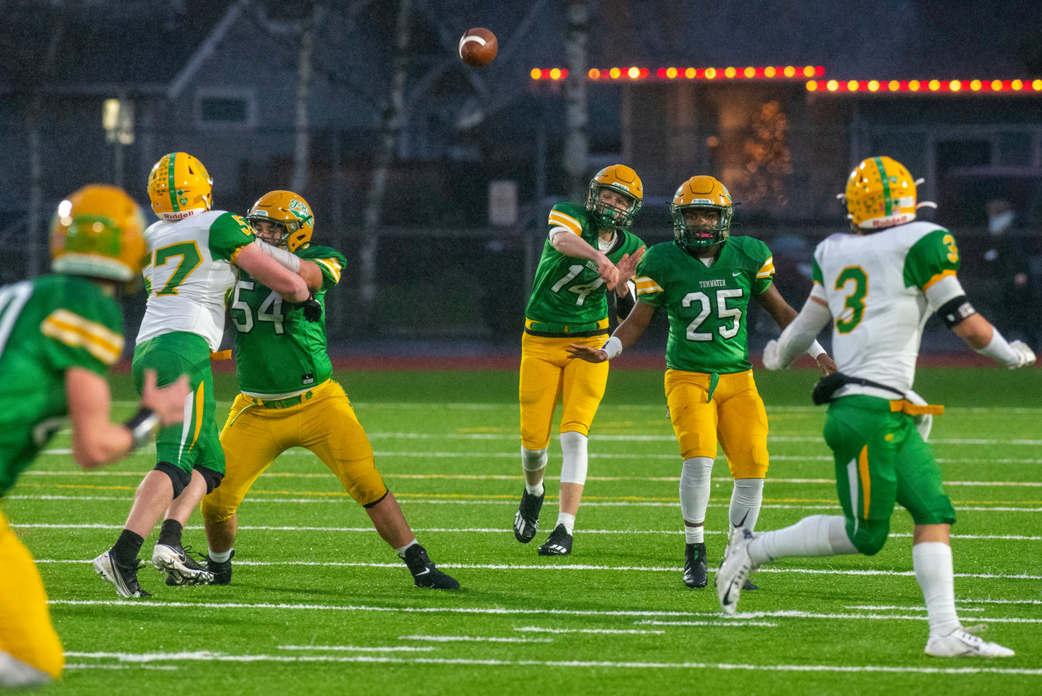 Tumwater’s Alex Overbay (14) tosses a pass downfield against Lynden during the 2A state title game on Dec. 4.