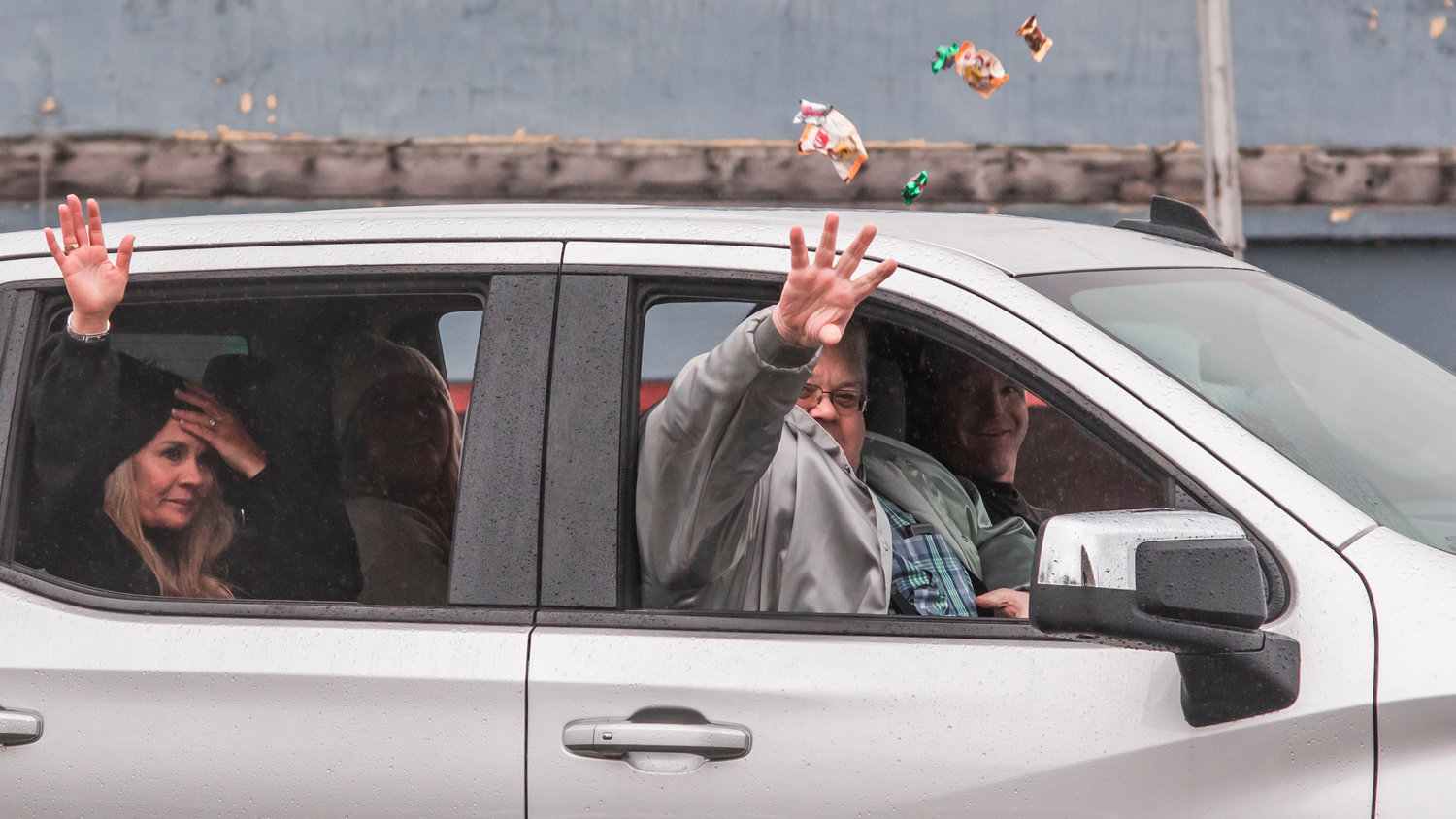 Grand Marshall Daryl Lund throws candy during the Santa Parade in downtown Chehalis on Saturday.