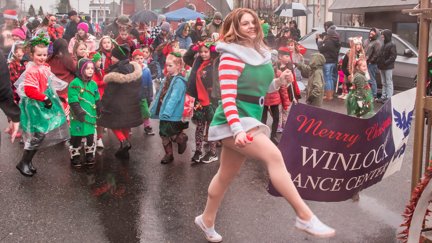 Members of the Winlock Dance Center make their way through downtown Chehalis during the Santa Parade in December 2021.