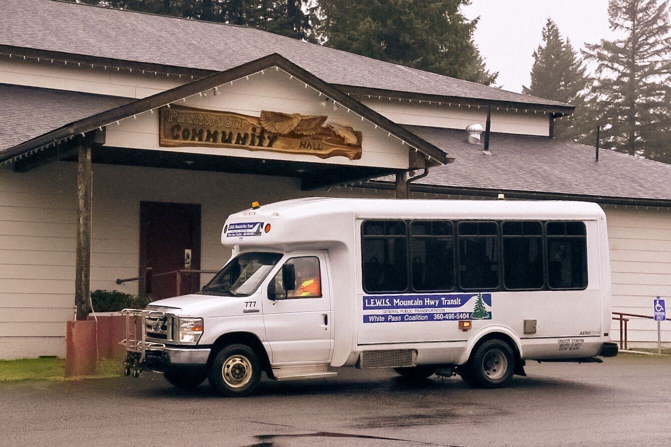 A L.E.W.I.S Mountain Hwy Transit vehicle is seen parked outside the Packwood Community Hall on Monday.