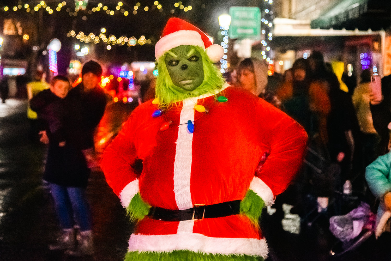 The grinch poses for a photo during the Lighted Tractor Parade in Centralia Saturday night.