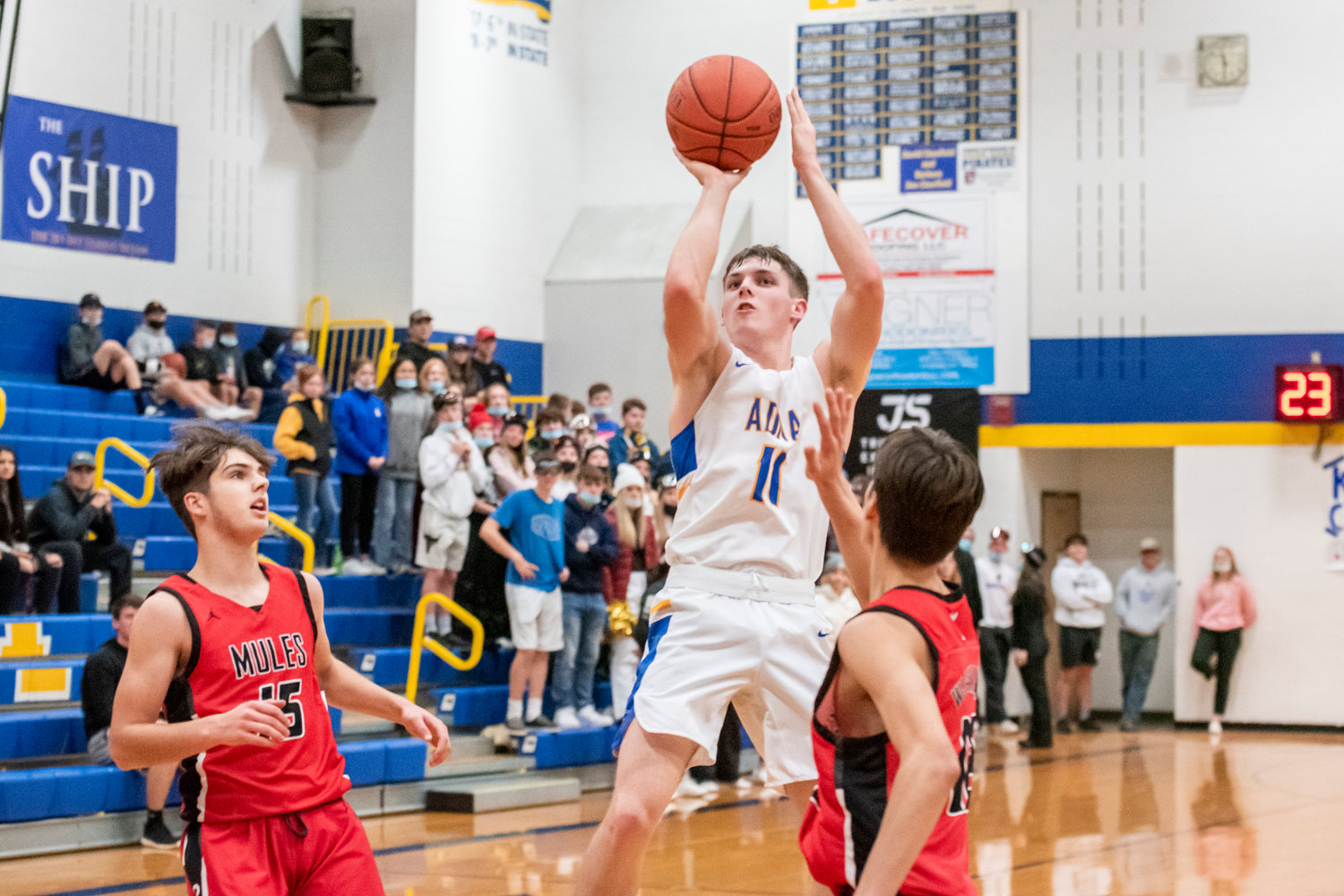 Adna’s Chase Collins (11) shoots over Wahkiakum defenders during a game earlier this season.