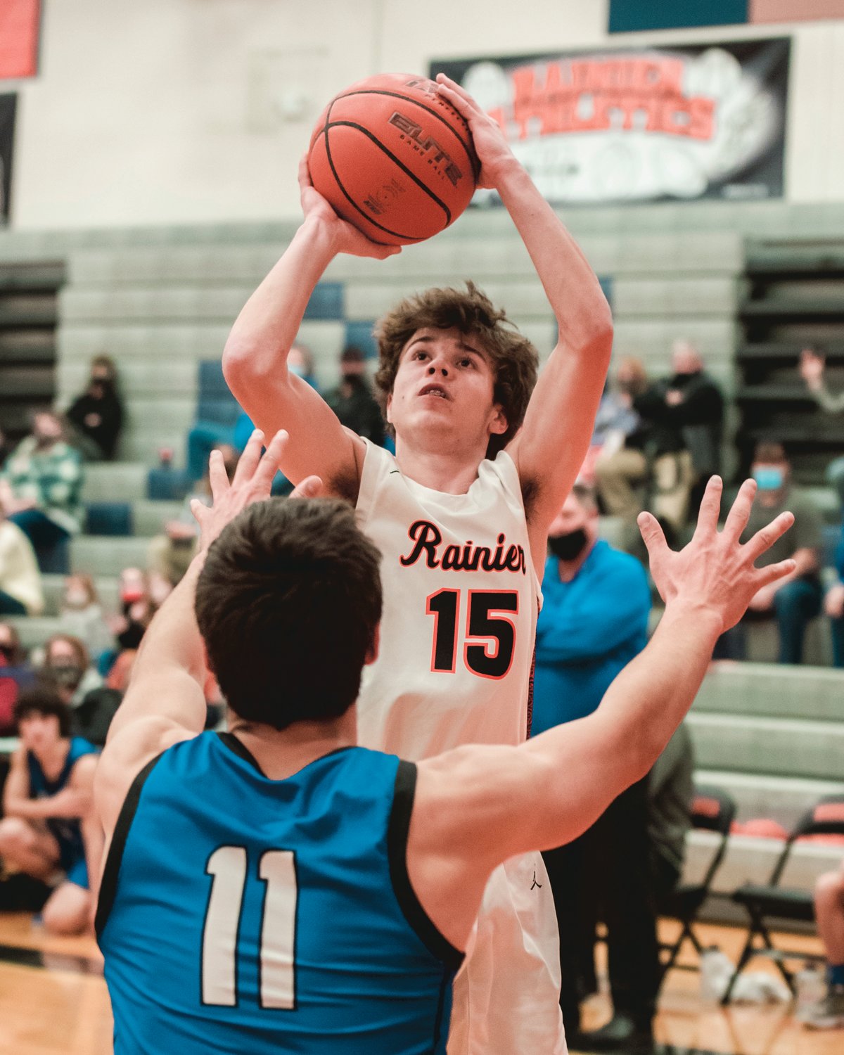 Rainier’s Jake Meldrum (15) looks to shoot during a game against Toutle Thursday night.