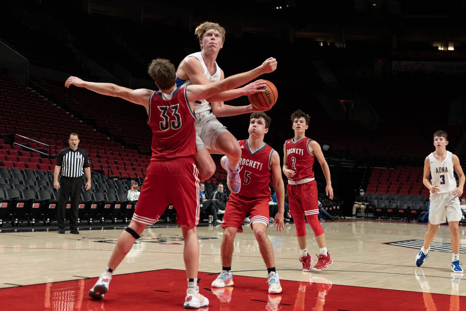 Adna forward Lane Johnson drives to the hoop against Castle Rock at the Moda Center in Portland Dec. 18.