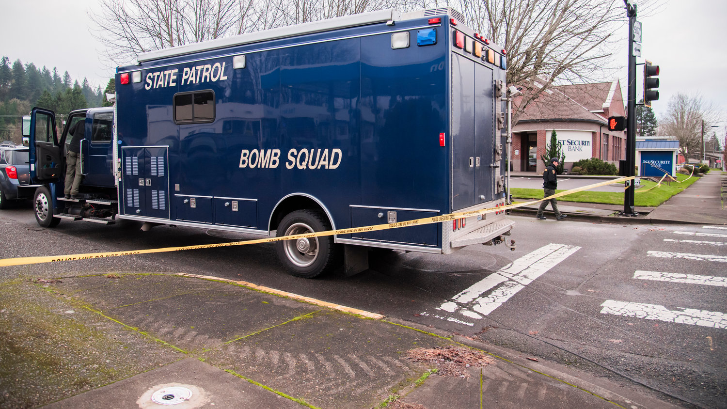The Washington State Patrol Bomb Squard arrives on the scene at the 1st Security Bank location at 604 South Tower Avenue in Centralia after reports of an explosion in the area Sunday morning.