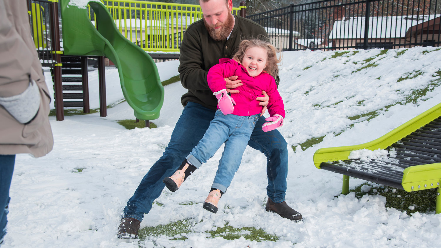 Paytynn, 3, smiles as she slides down a slide at Penny Playground Sunday in Chehalis