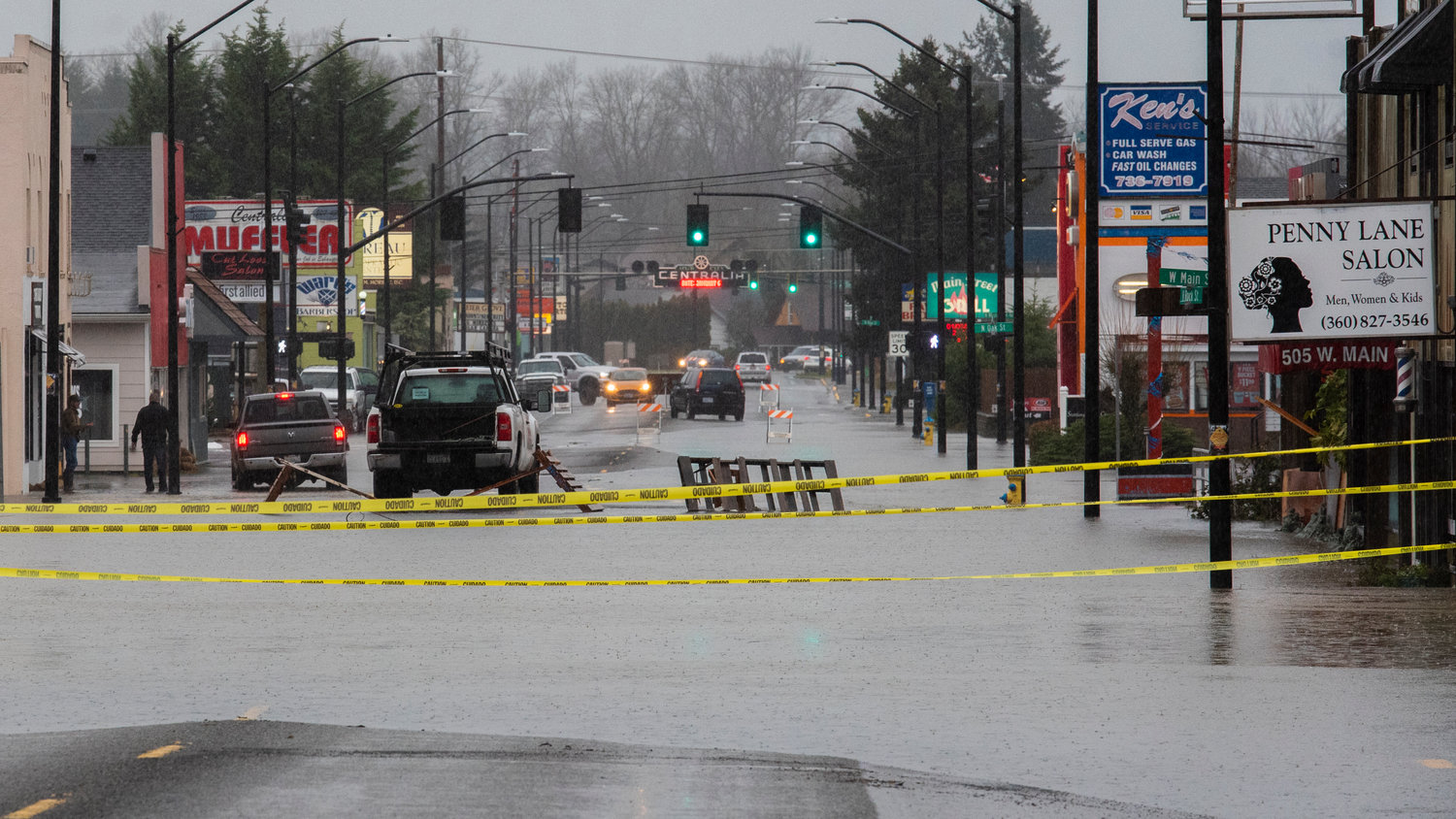 West Main Street in Centralia is taped off with caution tape as floodwaters stretch across the roadway on Thursday.