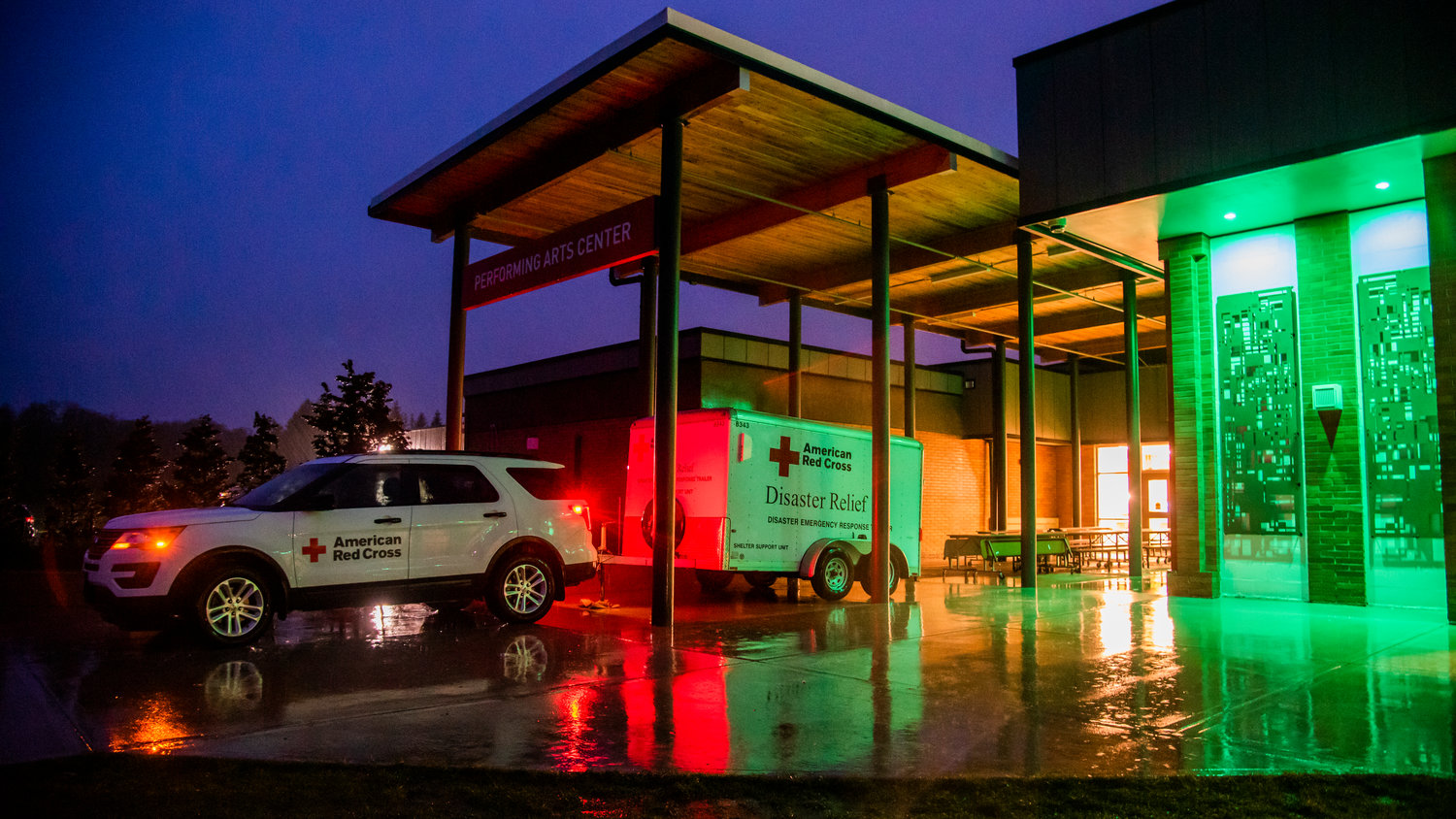 An American Red Cross vehicle sits outside Centralia High School before shifting resources to the Centralia Middle School after an evaluation of prior flood mapping Thursday evening.