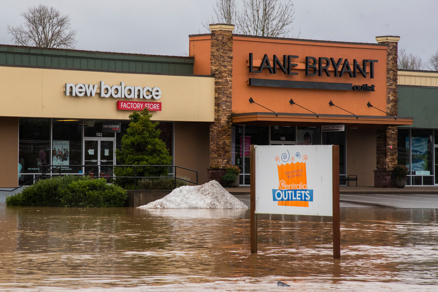 Floodwaters fill parking lots at the Centralia Outlets on Friday.