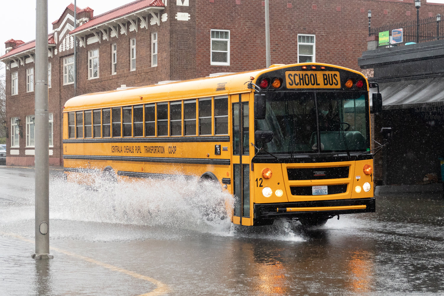 A Centralia school bus traverses flooded roads after an early release 1 p.m. in Downtown Centralia.