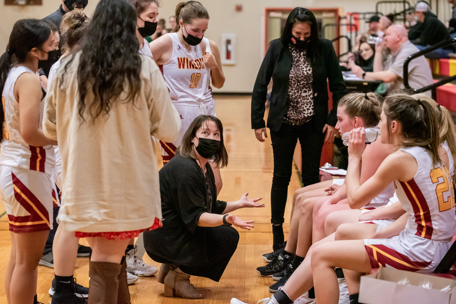 Winlock Head Coach Dracy McCoy talks to athletes during a game Tuesday night.