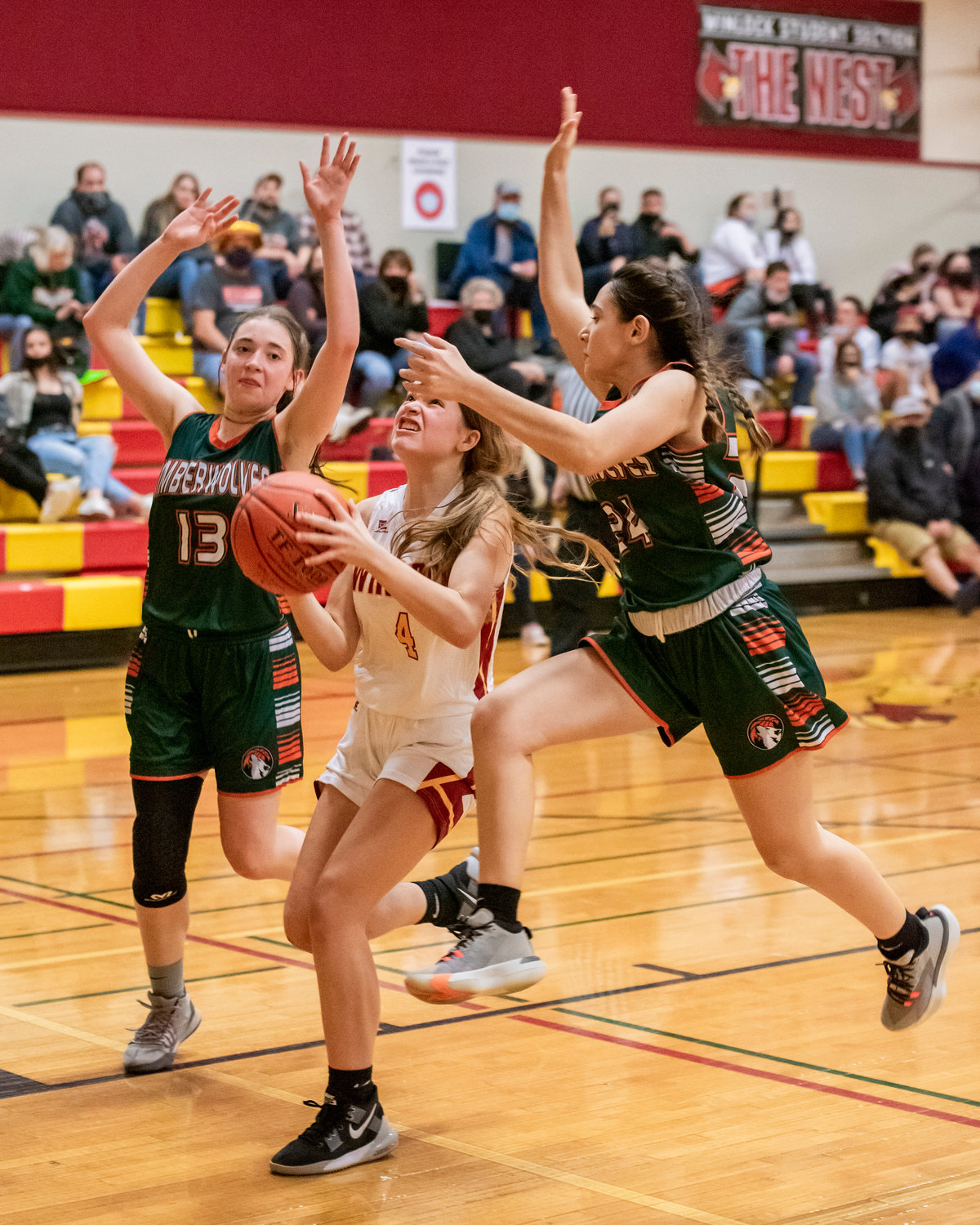 Timberwolves make a stop on defense as Winlock’s Kindyl Kelly looks to shoot Tuesday night.