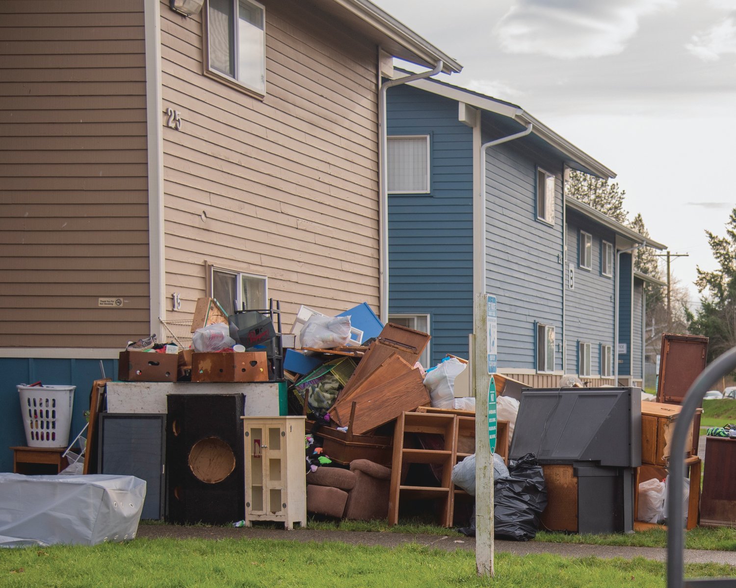 Furniture sits stacked outside the Chehalis Avenue Apartments in Chehalis after flood waters flowed through lower level apartments.