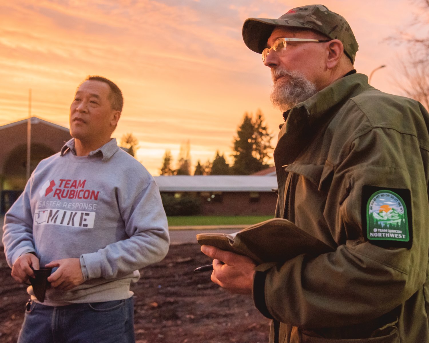 Michael Chiu and Karl Kaiyala, with Team Rubicon, talk about disaster response after flooding in Centralia on Wednesday.