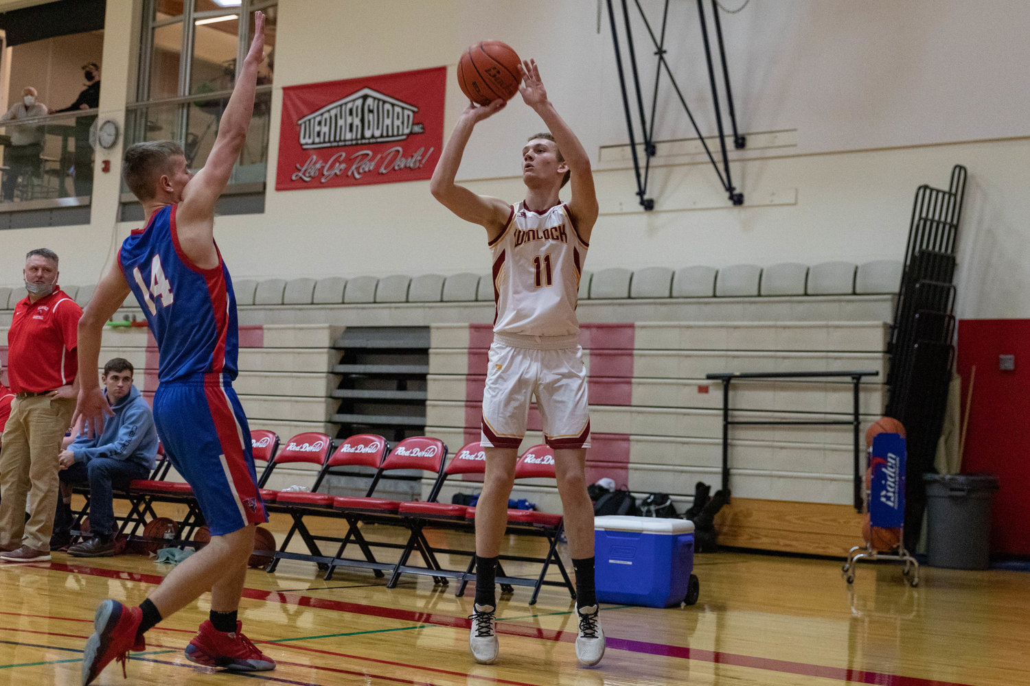 Winlock's Caleb Richendollar spots up for a 3 against Willapa Valley at the MLK Tribute at Lower Columbia Community College in Longview Jan. 17.